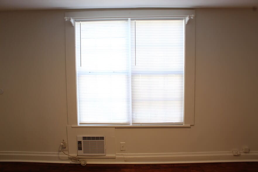 The back bedroom has two large windows. - 1309-C Jones Avenue