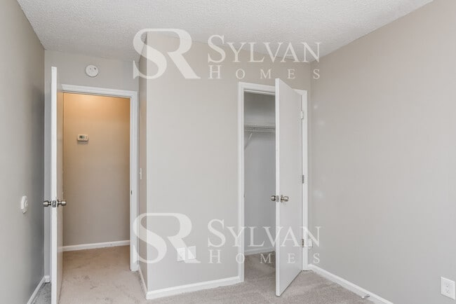 Building Photo - This home exudes a cheerful and welcoming charm!