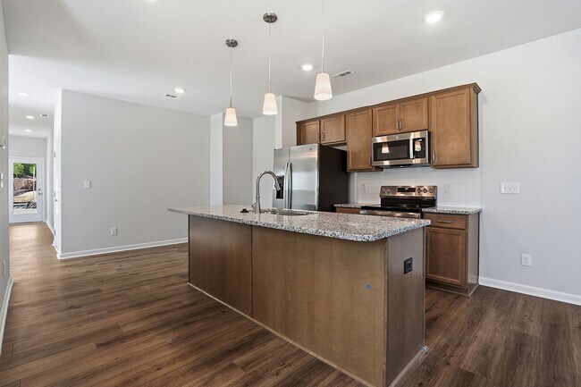 Building Photo - BRAND NEW TOWNHOME-9 FOOT CEILINGS-TWO CAR GARAGE-POOL COMMUNITY