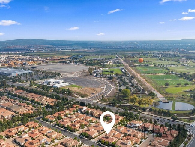 Building Photo - Rare 55+ Gated Travata Community – Bedrooms on Main + Loft + Resort-Style Amenities!