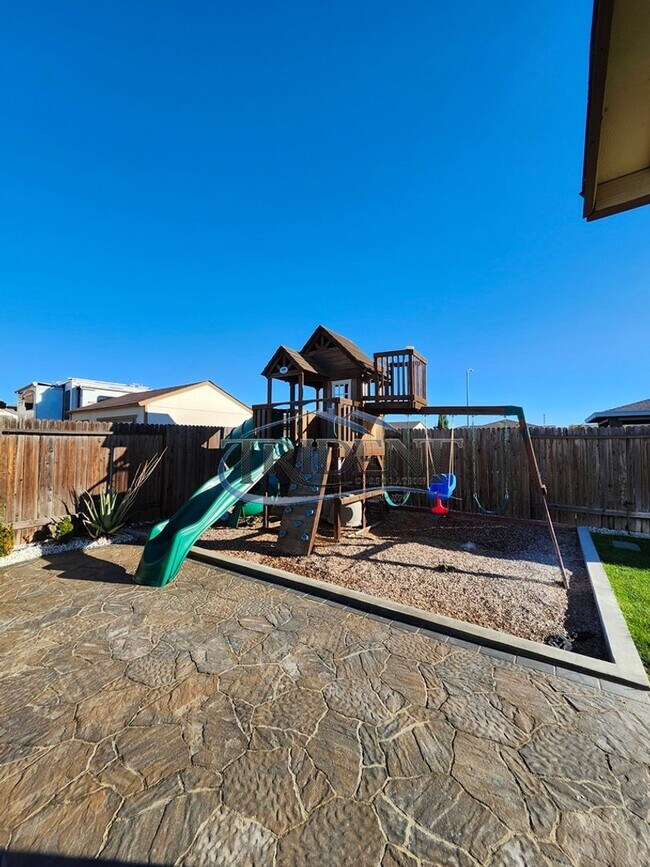 Building Photo - Updated home with a built in BBQ and play area
