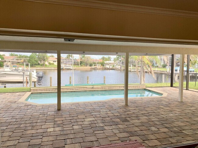 Building Photo - AVAILABLE 2027 SEASON! ! PGI HEATED POOL, WATERFRONT, BOAT LIFT