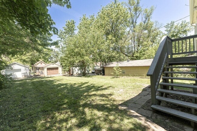 Building Photo - Remodeled 2-Bedroom Bungalow with Spacious Yard & 1-Car Basement Garage