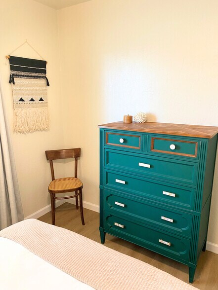Bedroom 2: Sleek dresser for ample storage and additional seating. - 1795 W 28th St