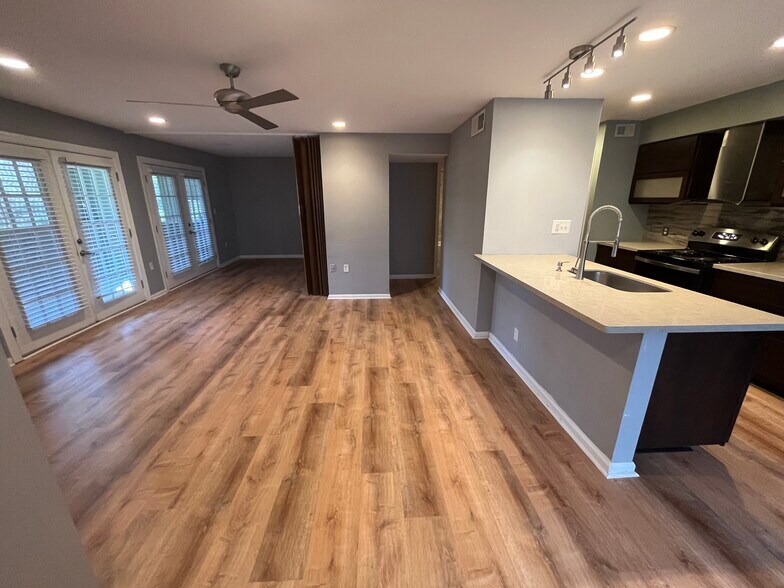 Living room and second bedroom- unique feature is accordion wall - 417 W 8th St