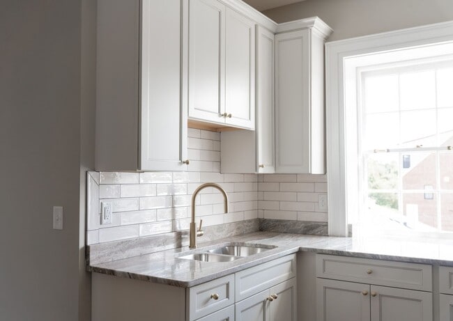 Building Photo - Renovated One-Bedroom Gem Steps from Train...