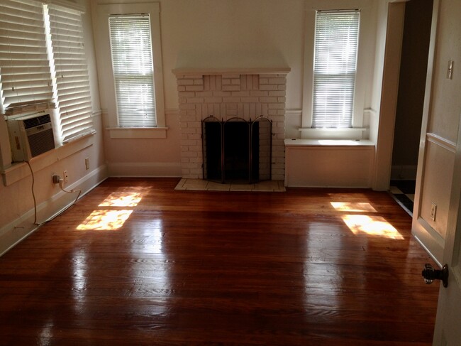 Gas fireplace and hardwood floors in living room - 720 W Hancock St