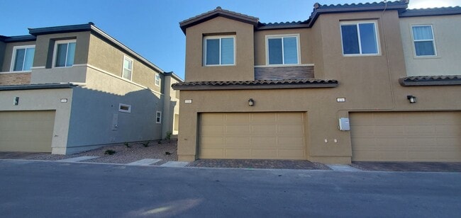 Building Photo - Beautifully designed modern townhome with attached garage.