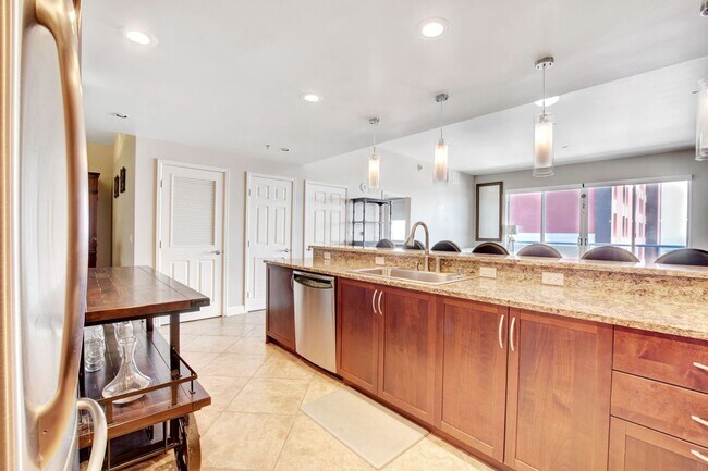 Building Photo - Fully Furnished Luxury Condo at The Ogden – Downtown Living at Its Finest!