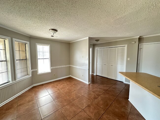 Building Photo - Grand 4BR/2BA Near Southwind | 2,438 Sq Ft, Stone Fireplace, Soaking Tub & 2-Car Garage