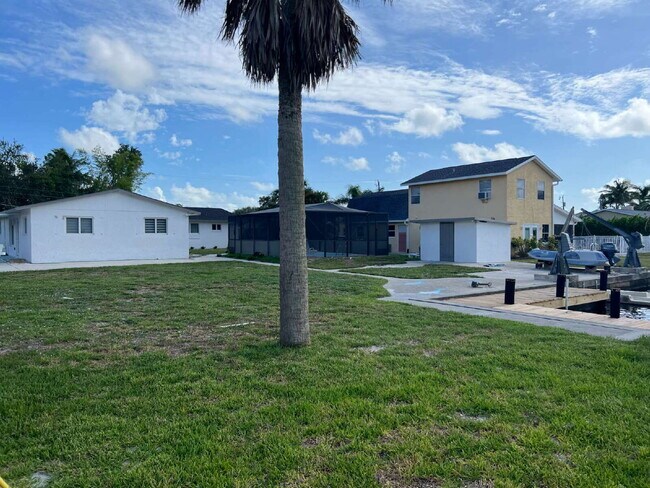 Building Photo - Charming 1-Bed Retreat Waterfront W/Pool W...