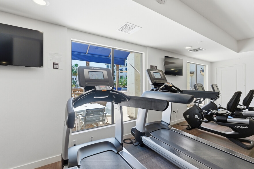 Modern fitness center featuring cardio, free weights, and strength equipment. - 2511 W Queen Creek Rd
