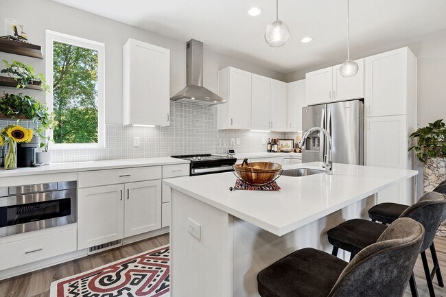 Building Photo - Live Elevated in Downtown Raleigh – Stunning Townhome with Rooftop Oasis!