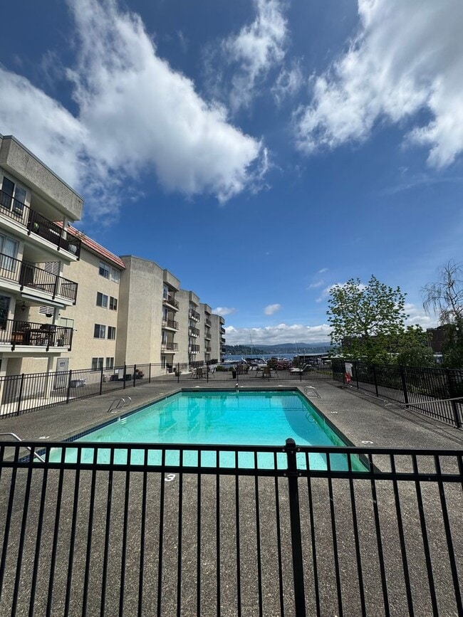 Building Photo - Gorgeous Condo in Seward Park with 2 Parking Spaces, Steps Away from Pool with Water View!