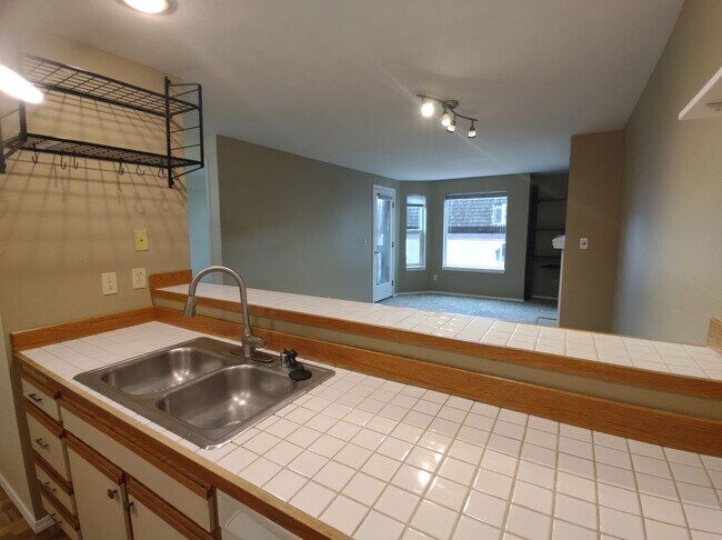 Building Photo - Well-Maintained 1BR Condo Near North Seattle College with Parking & Storage