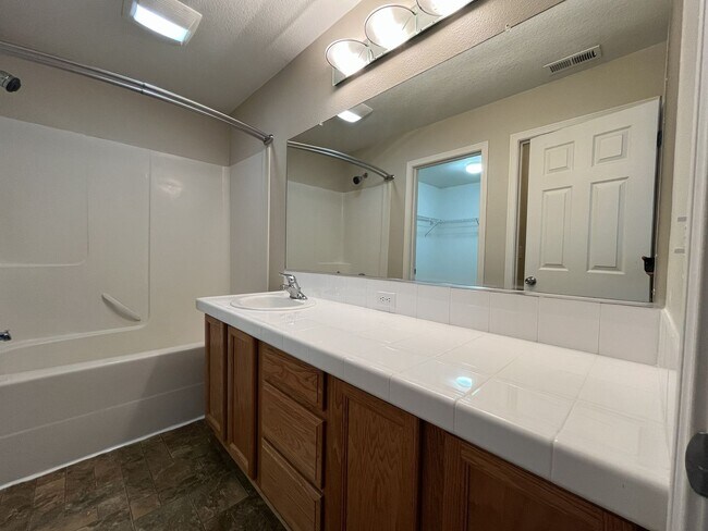 Building Photo - Inviting Two-Story 3BR Home Featuring Gas Range, Walk-In Closet, and Built-In Deck Seating