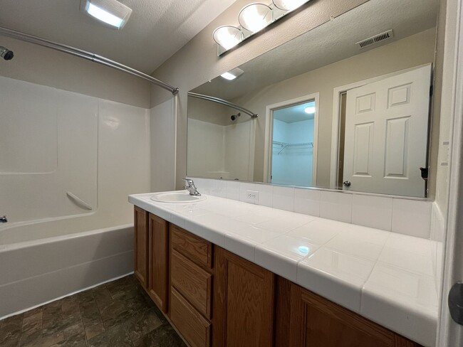 Building Photo - Inviting Two-Story 3BR Home Featuring New Carpet, New Stainless Appliances, Spacious Garage Stora...