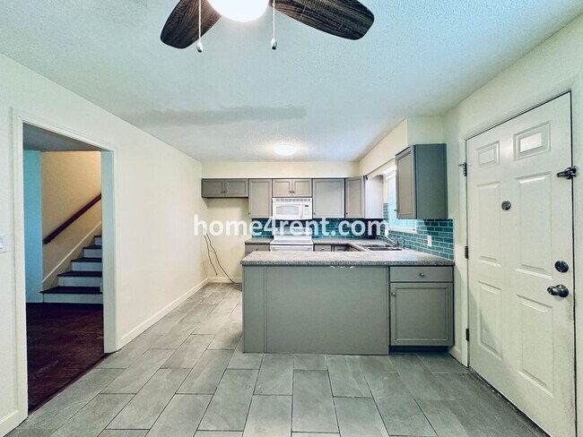 Building Photo - Olathe Duplex w/ Wood Floors, Finished Basement, and a Fenced Yard!