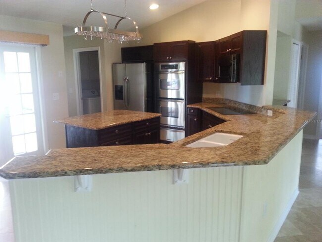 Building Photo - 9149 Palm Tree Dr