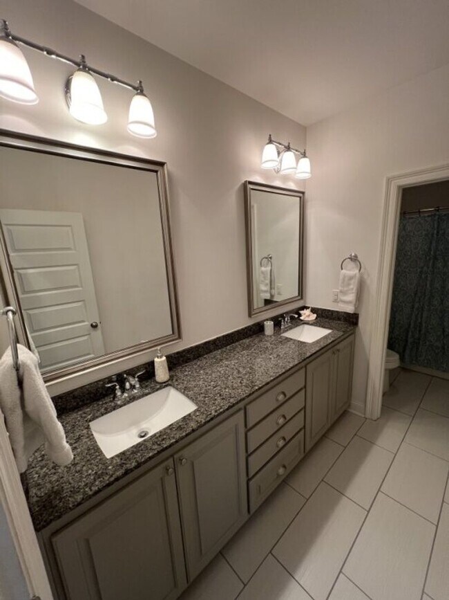 Building Photo - Luxury 4BR Home in Americana | 11 Ft Ceilings, Courtyard Living & Furnished Option