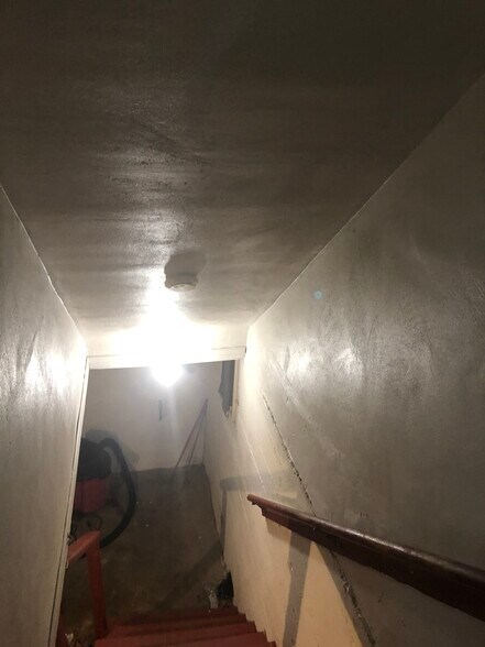 stair well to basement above ground - 632 McDowell Ave NW