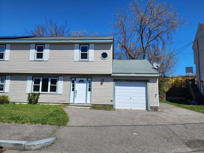 Building Photo - Beautifully remodeled townhouse with garage.