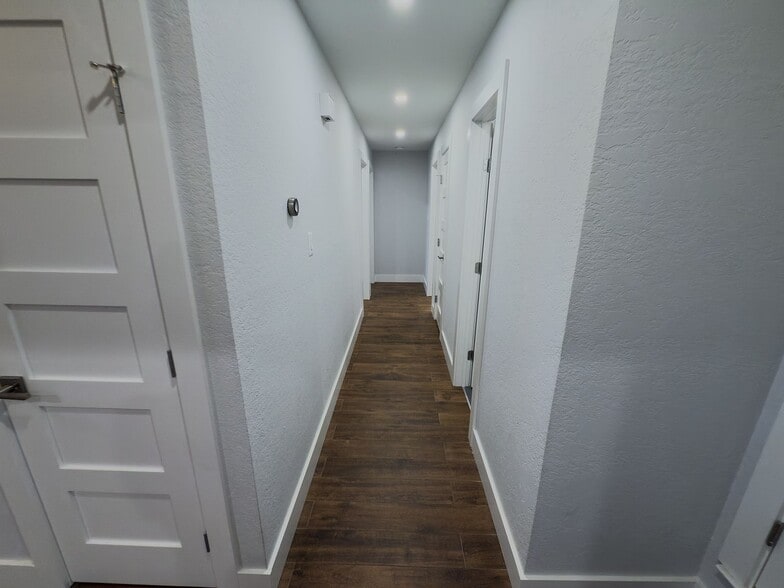 Bathroom entry showing towel bar and updated finishes - 2006 Candle Ct