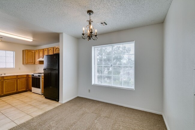 Building Photo - Charming Second-Floor Condo with Two Bedrooms and Fireplace