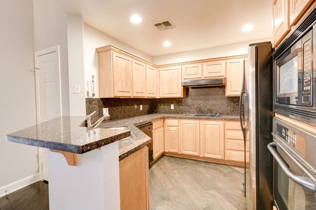 Building Photo - Luxury Guard-Gated 2-Bedroom Condo with Private Garage & Resort Amenities!