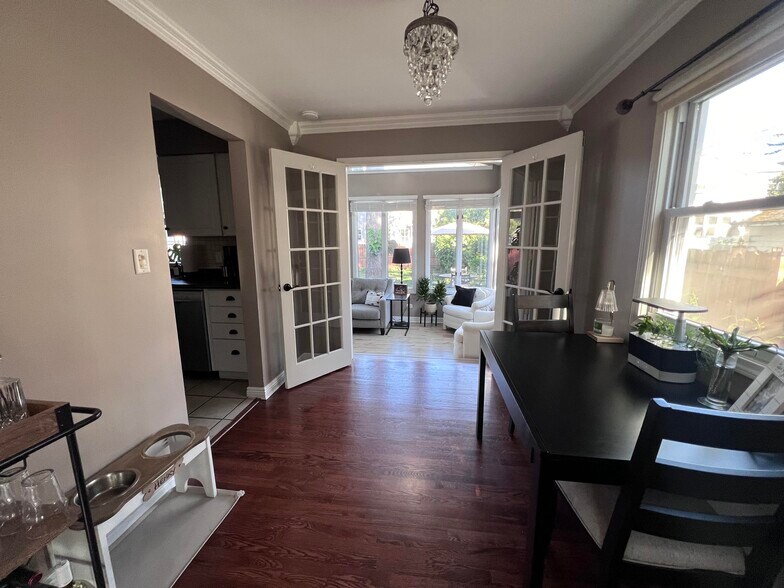 Dining area plus entry into beautiful sunroom. - 1336 N Eagle St