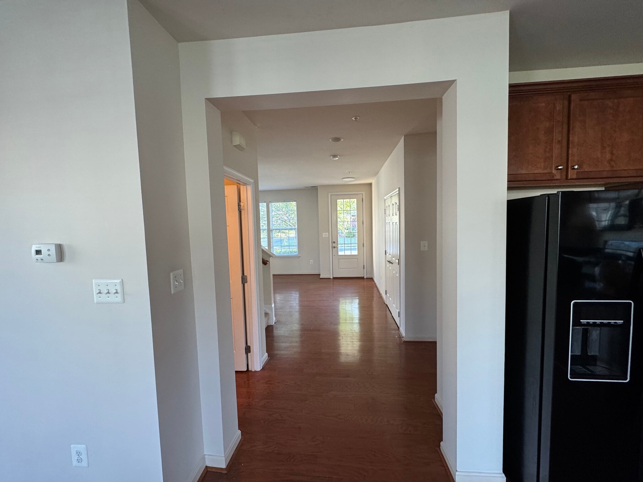 Here's a view from the great room and kitchen to the front door. - 44520 Gray Wolf St