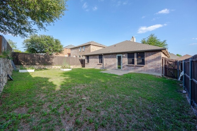 Building Photo - Great curb appeal from the mature shade tr...