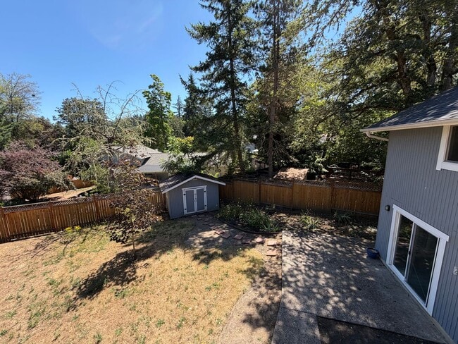 Building Photo - Spacious 4BR/3BA Home with Deck, Fenced Yard & Garage