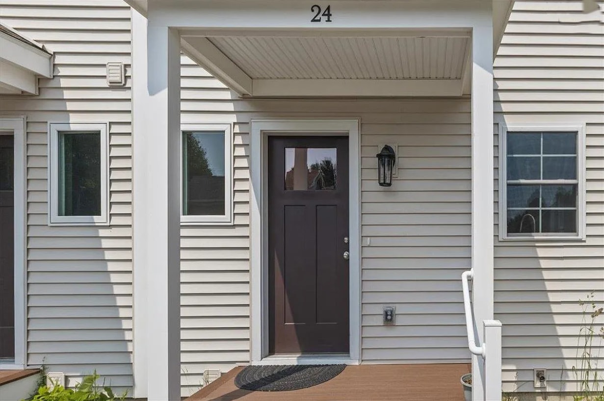 This is your new front door with a small porch for plants. - 24 Wilsons End Pl