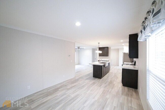 Building Photo - Spacious 4-Bedroom Home with Lawn Maintena...