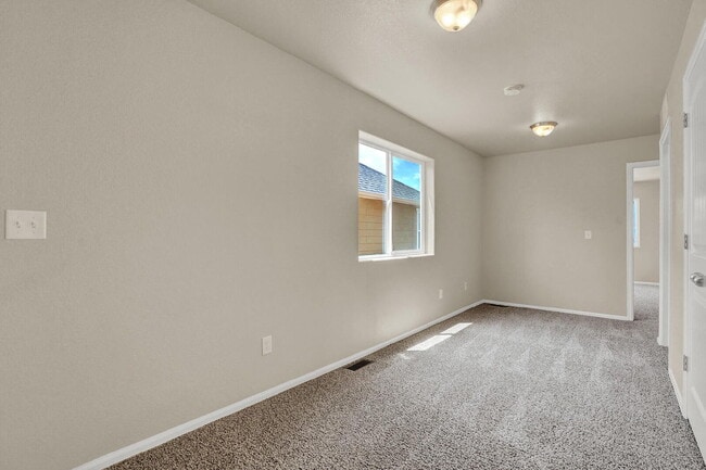Building Photo - Modern Townhome with Central A/C, 2-Car Ga...