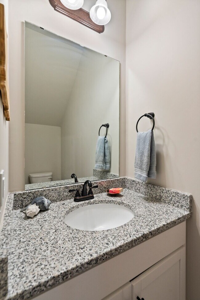 Building Photo - Available Now! Enjoy low-maintenance coastal living in this beautiful 2-bedroom, 2.5-bath townhom...