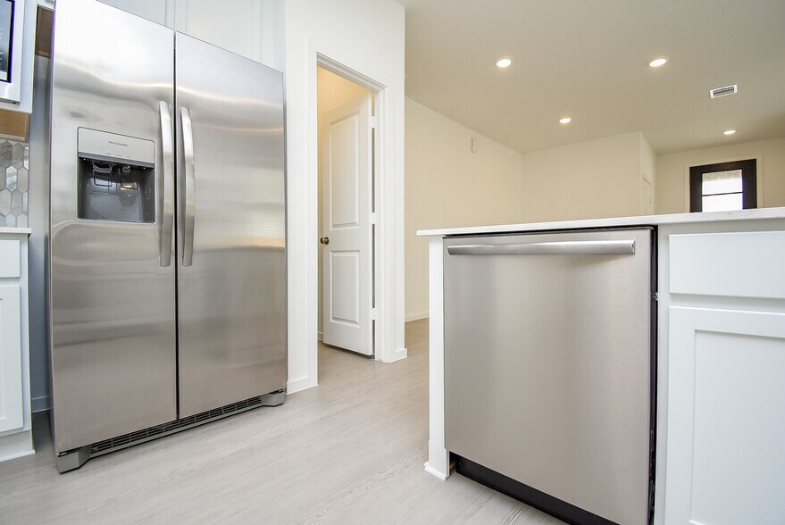 stainless steel dishwasher and refrigerator - 6714 Iron Clover Dr