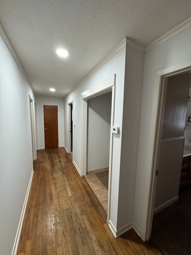 Hallway. Laundry on right. - 915 Taylor St