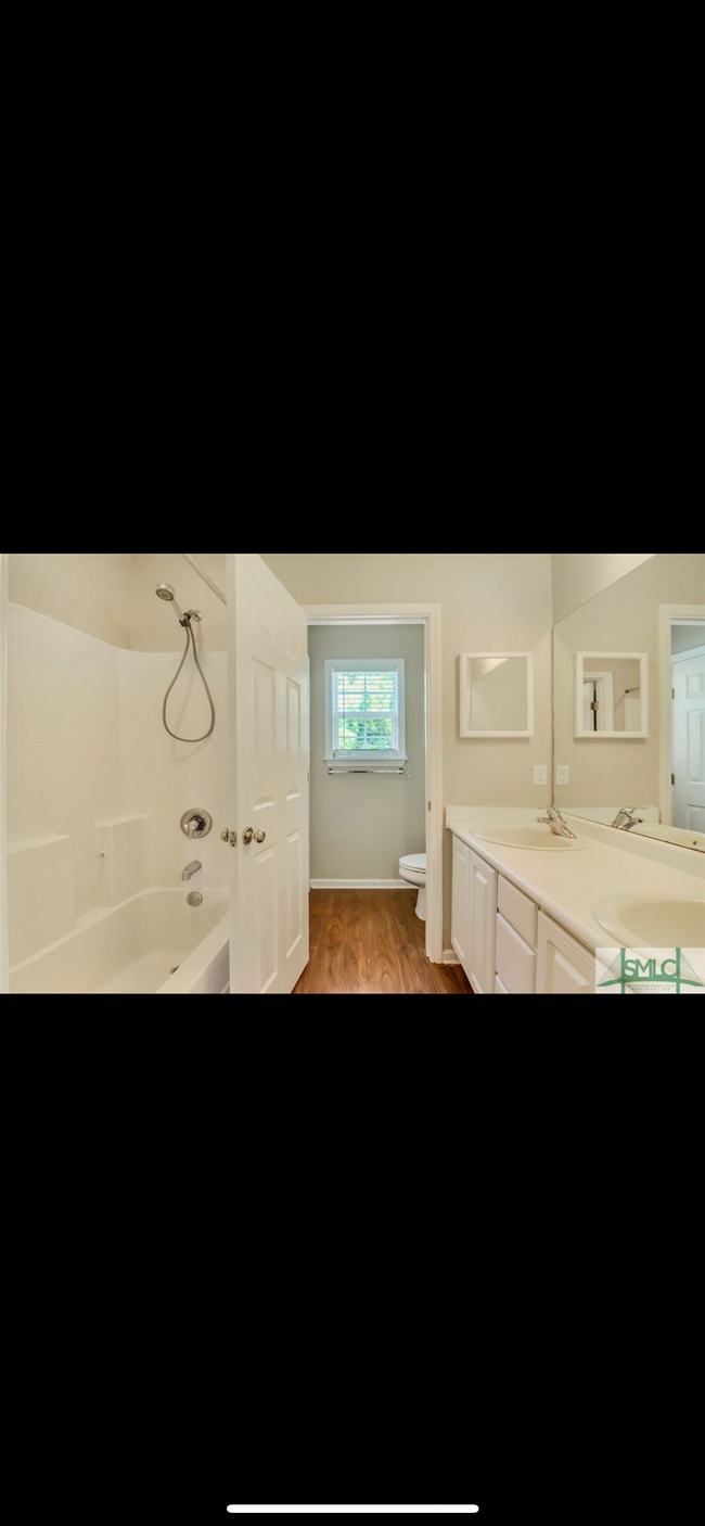 Upstairs Bathroom— brand new flooring updated after this photo - 400 Tibet Ave