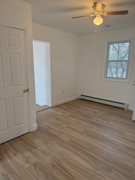 Living room with coat closet. - 410 E Point Pleasant Ave