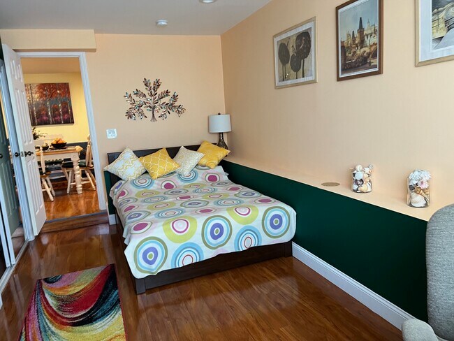 Bedroom 1 - full size bed, upholstered convertible chair-bed, desk, desk chair, large closet - 1627 15th Ave