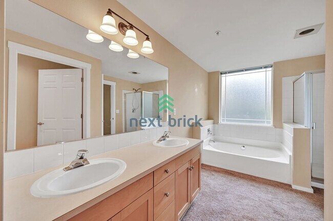 Building Photo - Rare Ground-Floor, End Unit with massive b...