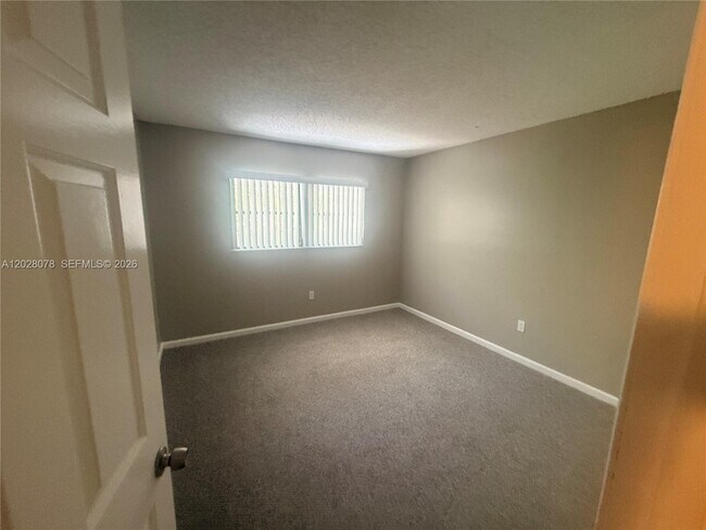 Building Photo - 10787 Royal Palm Blvd