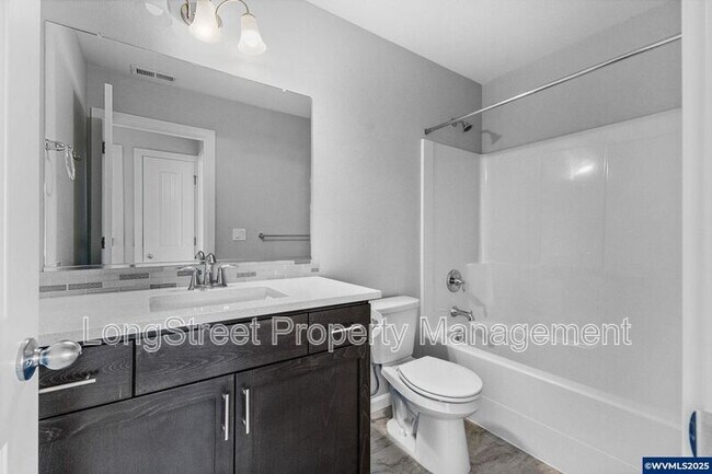 Building Photo - 7177 SE Sarah Dr