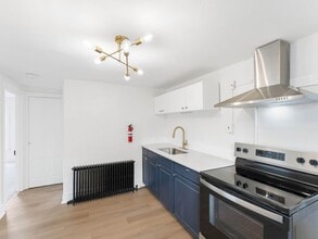 Building Photo - Renovated 3-Bedroom Apartment with Bonus Finished Attic & Spacious Shared Backyard