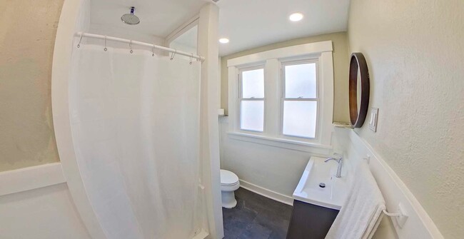 Building Photo - Two Updated Kitchens + Waterfall Shower + ...