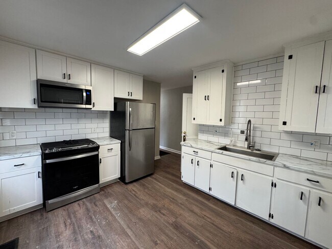 Building Photo - McQueen Street 4-plex - SMITK-LILY