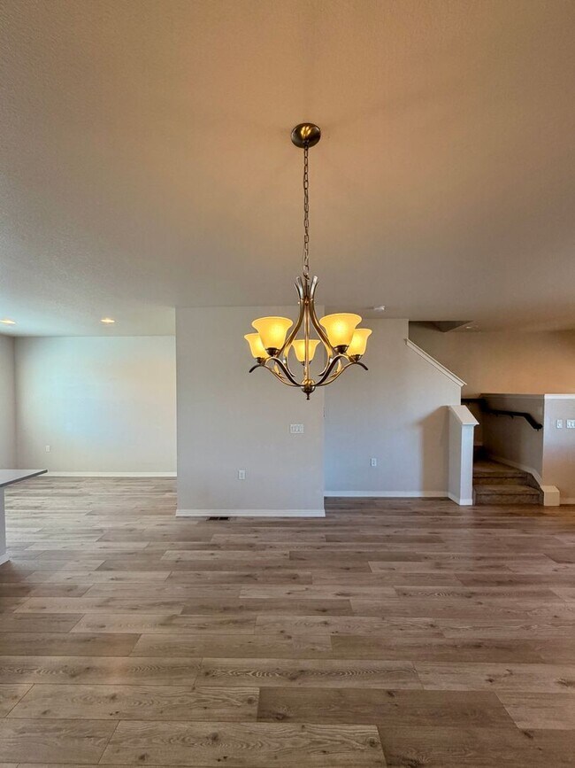 Building Photo - Move-In Ready 3-Story Townhome with Loft & 2-Car Garage