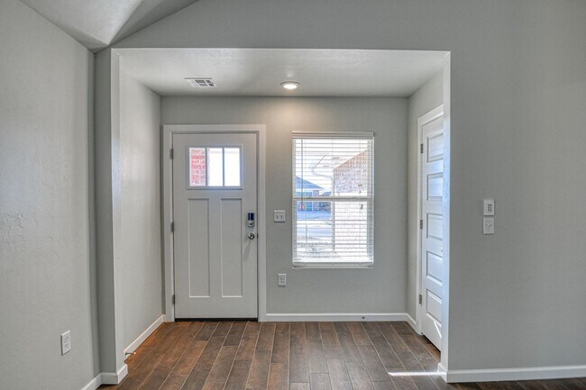 Building Photo - New Construction in Varenna Landing! Storm shelter and lawn care included!